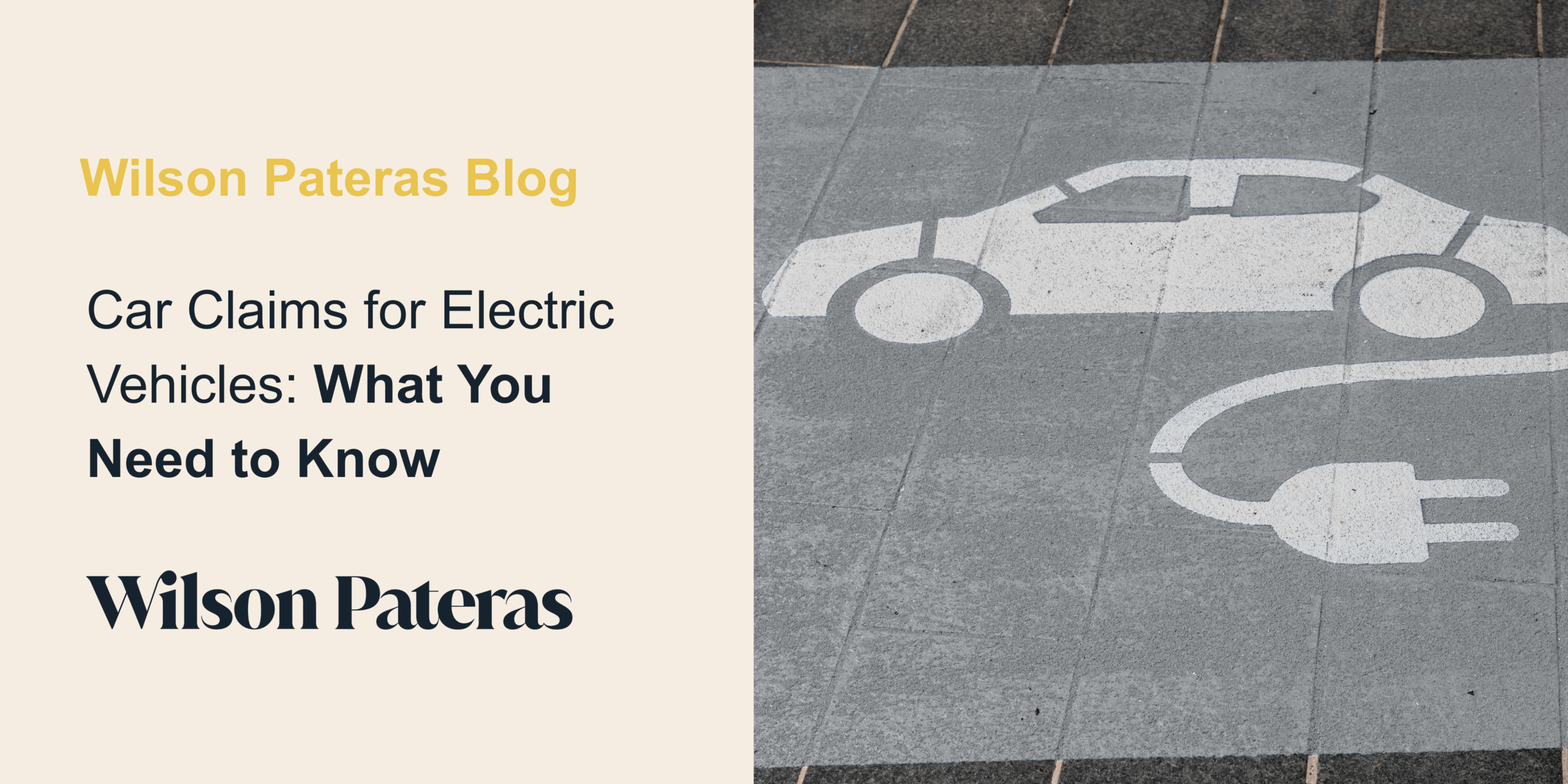 Pictured, a stock picture on the right hand side of a concrete section of the road with a white stencilled car with an electricity cord coming out of the boot to represent an electric vehicle